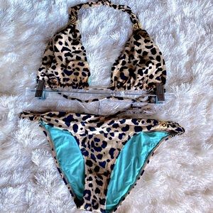 Vix leopard two-piece swimsuit with gold hardware.